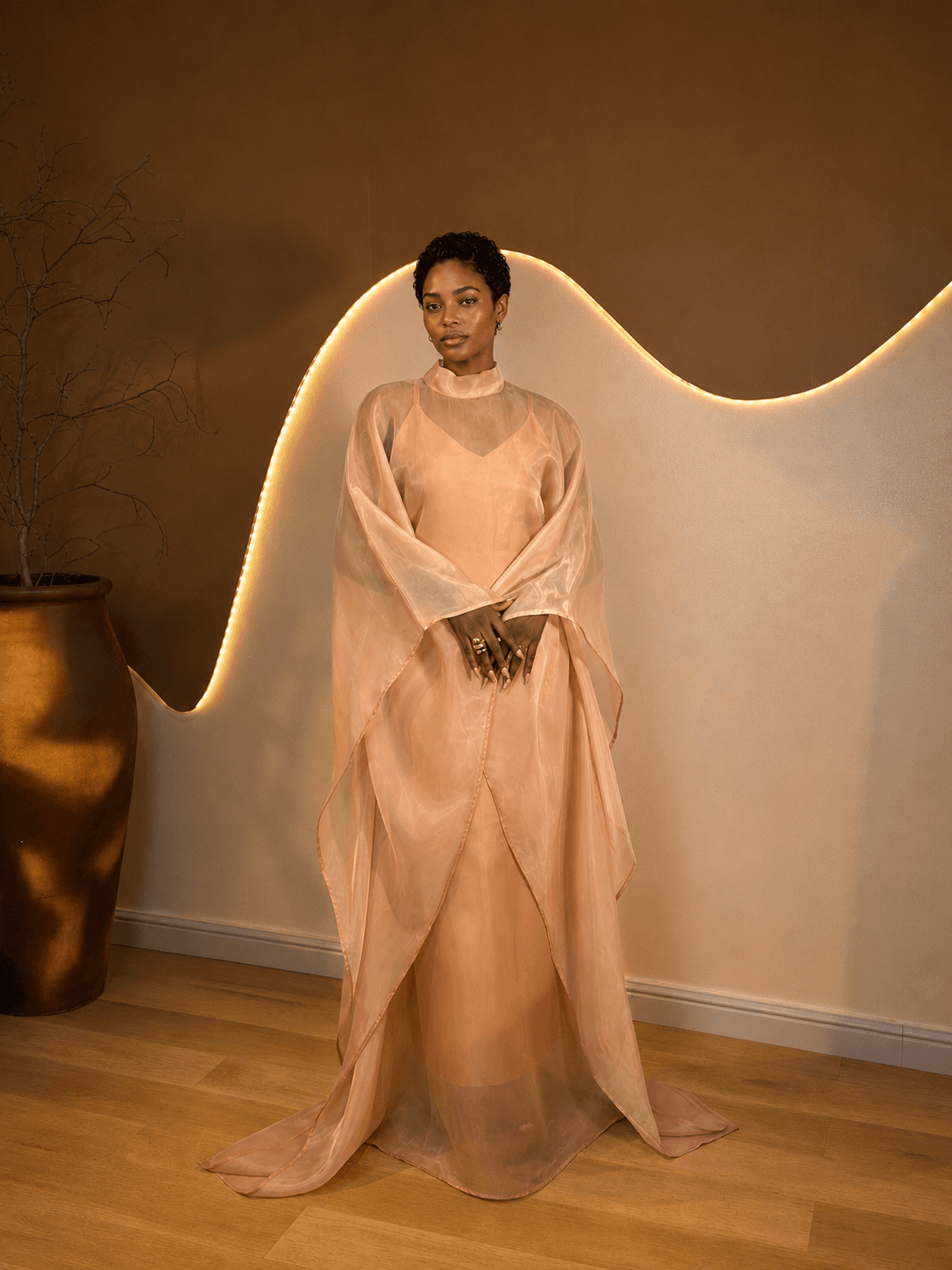 Model wearing Omi Duo – Peach Champagne in a full front view.